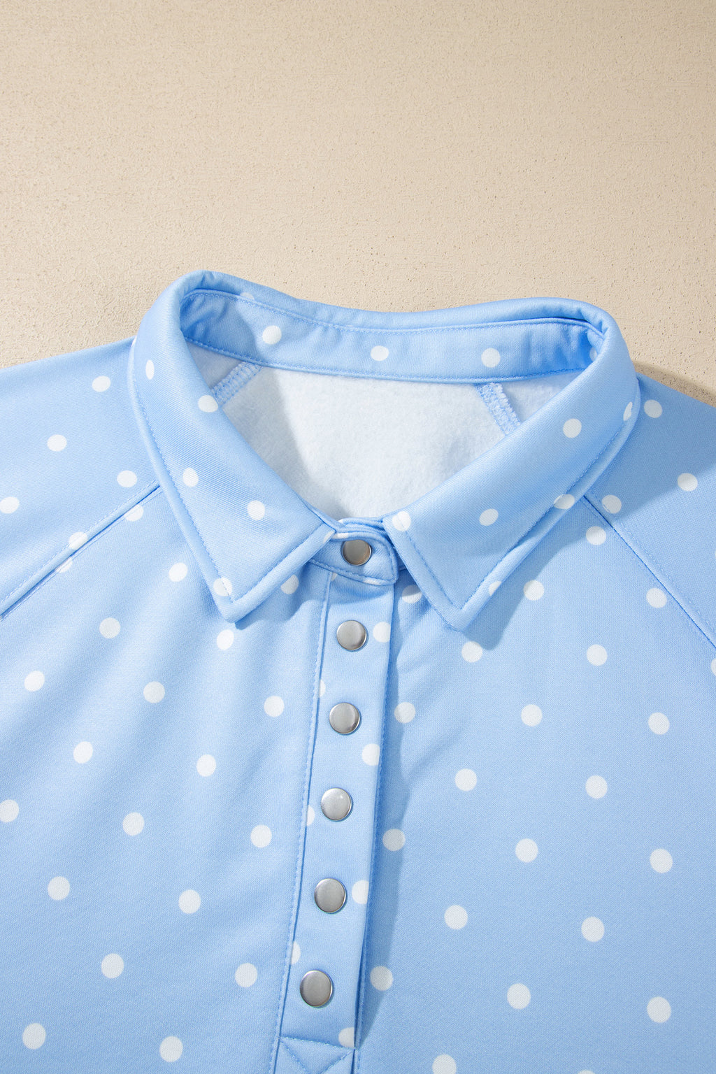 Sky blue plus size sweatshirt with polka dots, V-neck, metal buttons, long sleeves, and shift fit from Dear-Lover.