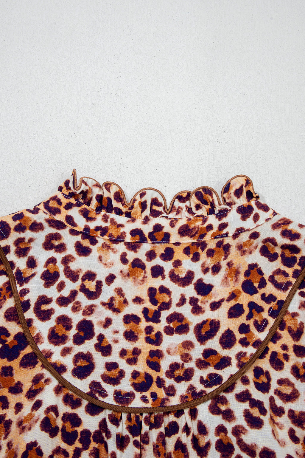 Brown plus size leopard print blouse with frilled stand collar, made from viscose, stylishly designed for plus size women.