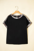 Black plus size leopard patchwork round neck loose tee by Dear-Lover, showcasing a relaxed fit and stylish leopard print design.