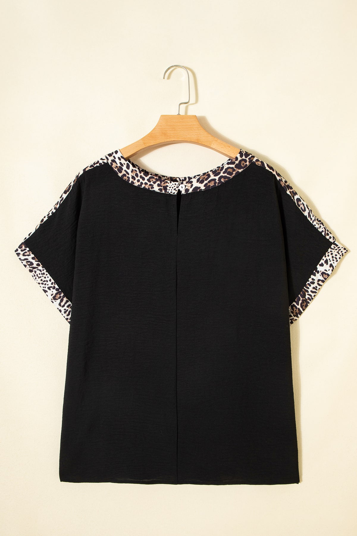 Black plus size leopard patchwork round neck loose tee by Dear-Lover, showcasing a relaxed fit and stylish leopard print design.
