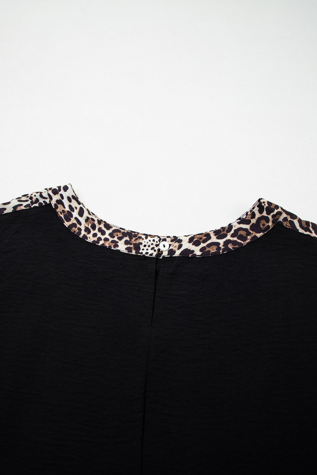 Black plus size leopard patchwork round neck loose tee from Dear-Lover, made of 100% polyester, featuring a relaxed fit and bold animal print.
