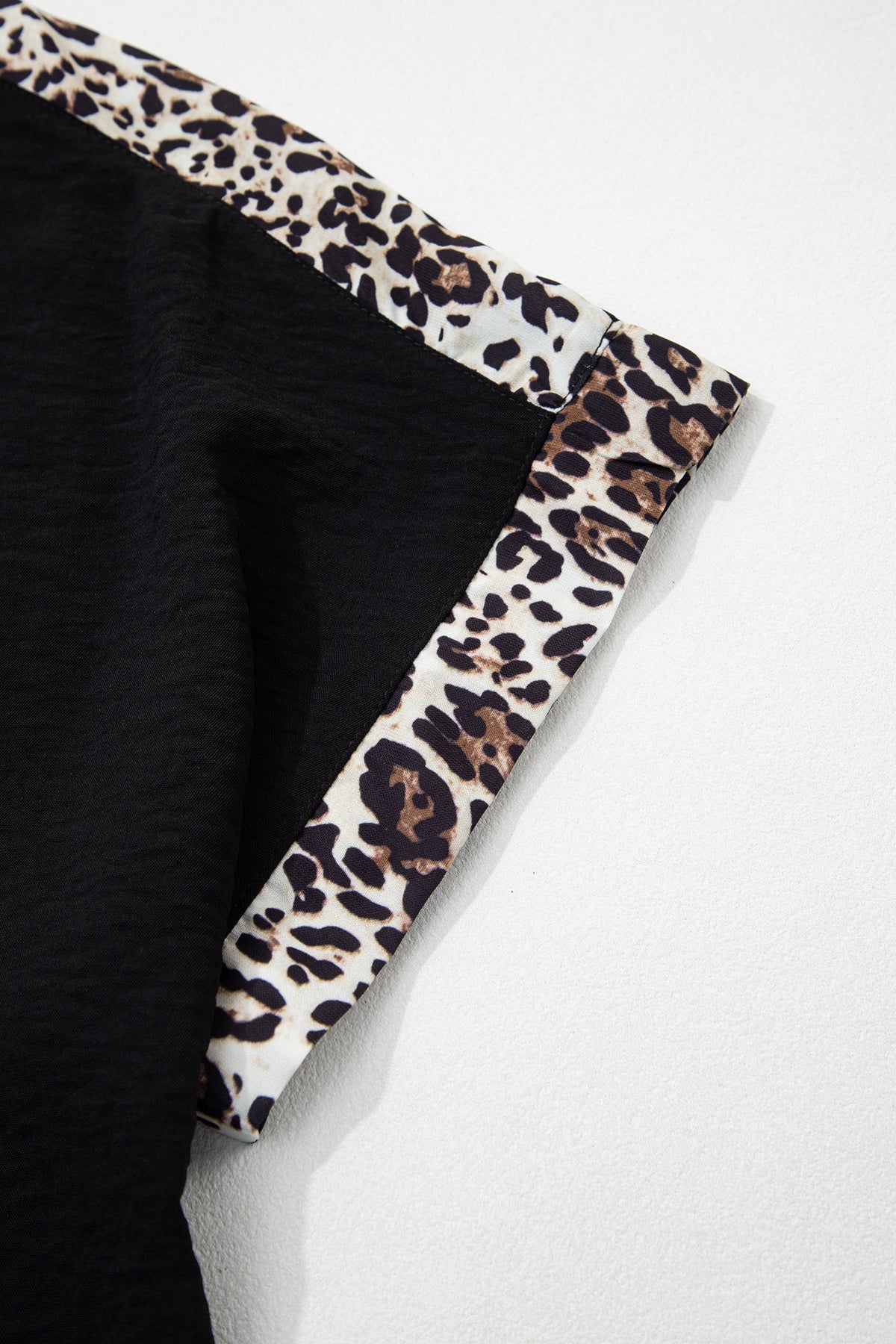 Black plus size leopard patchwork loose tee from Dear-Lover, round neck, comfortable polyester top for plus size women.