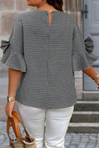 Black plus size plaid jumper with bow detail, bell sleeves, and round neck, made of polyester and elastane for a comfortable fit.