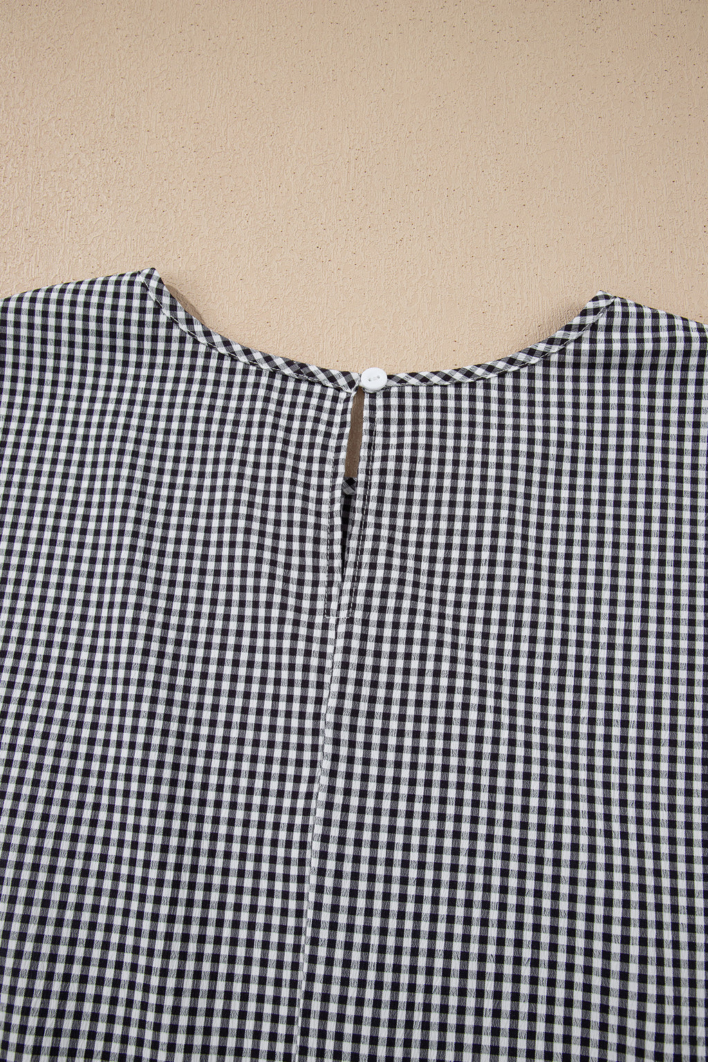 Black plus size plaid jumper with bow decor, bell sleeves, and round neck, made from polyester and elastane by Dear-Lover.