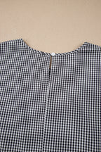 Black plus size plaid jumper with bow decor, bell sleeves, and round neck, made from polyester and elastane by Dear-Lover.