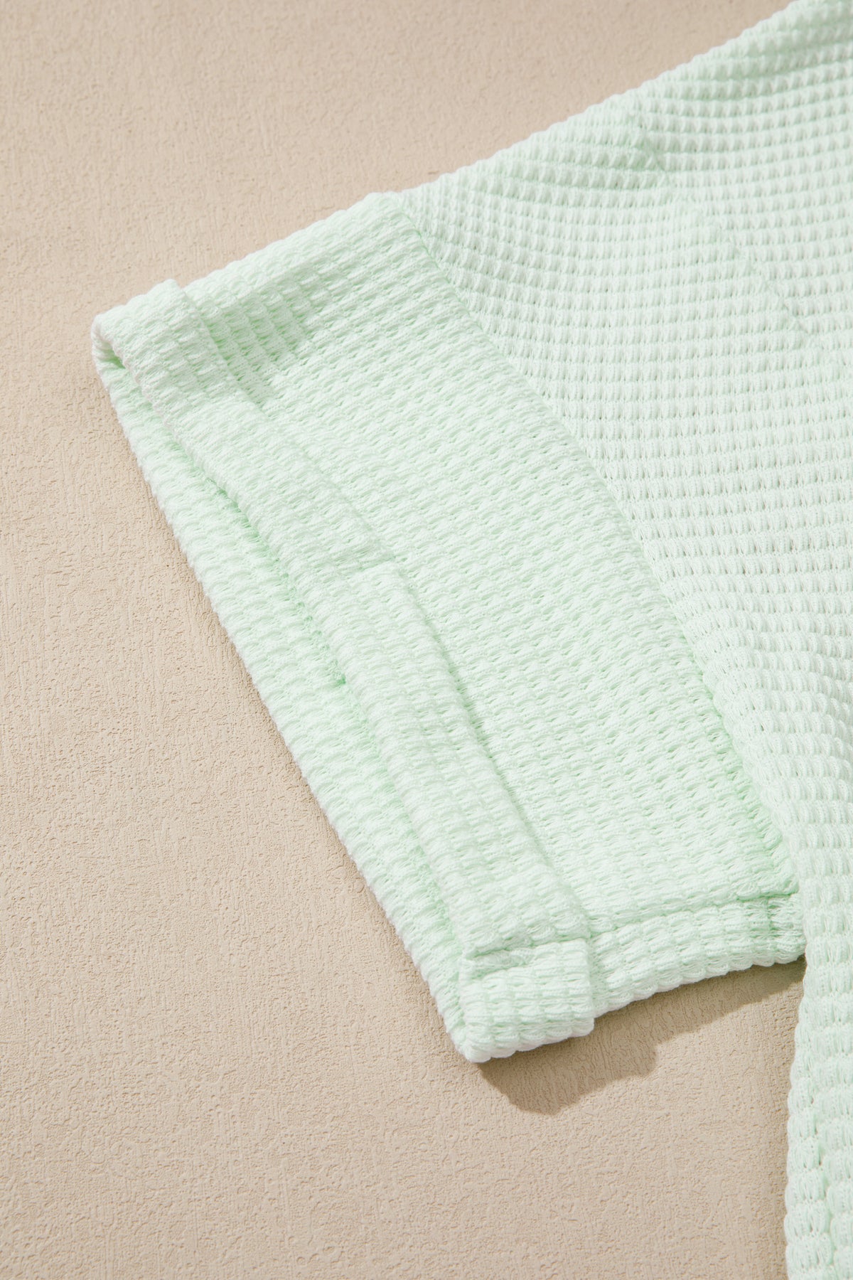 Plus size Wisteria V-neck short sleeve waffle knit top by Dear-Lover, featuring a cozy textured fabric and a relaxed fit.