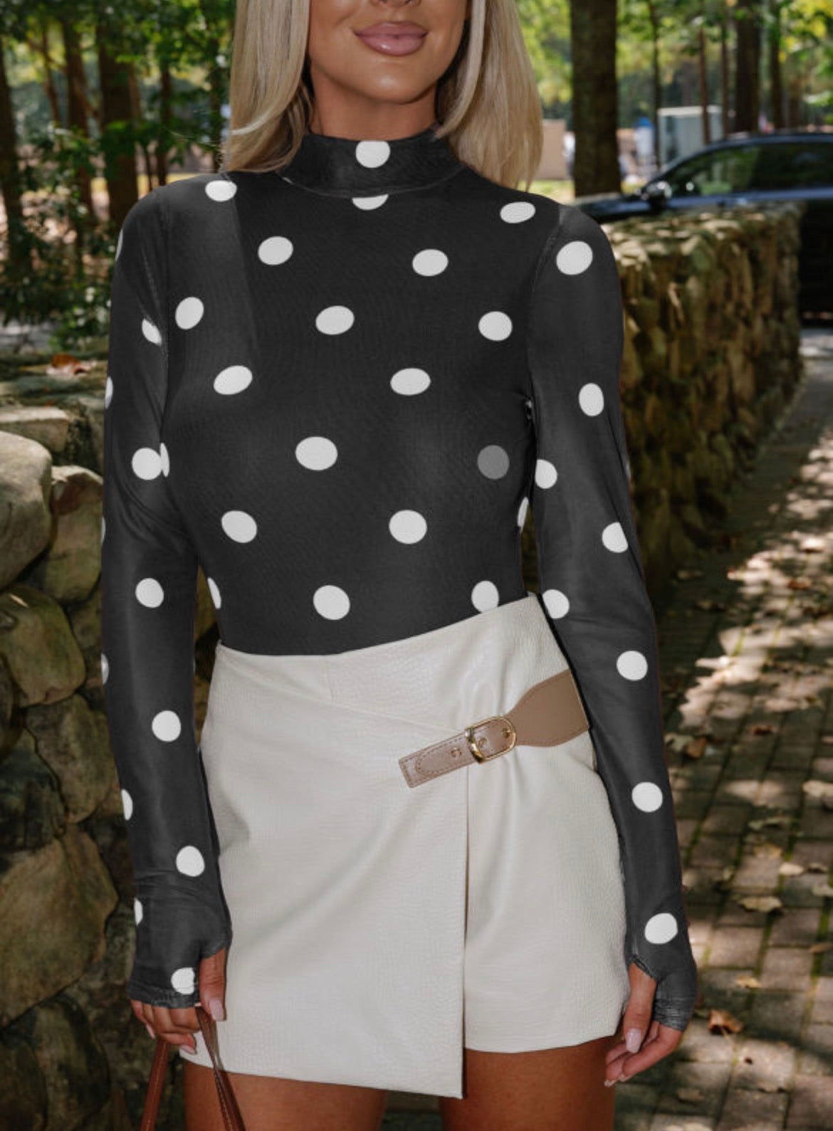 Black vintage polka dot mesh long sleeve bodysuit from Dear-Lover, featuring a stylish retro design and fitted silhouette.