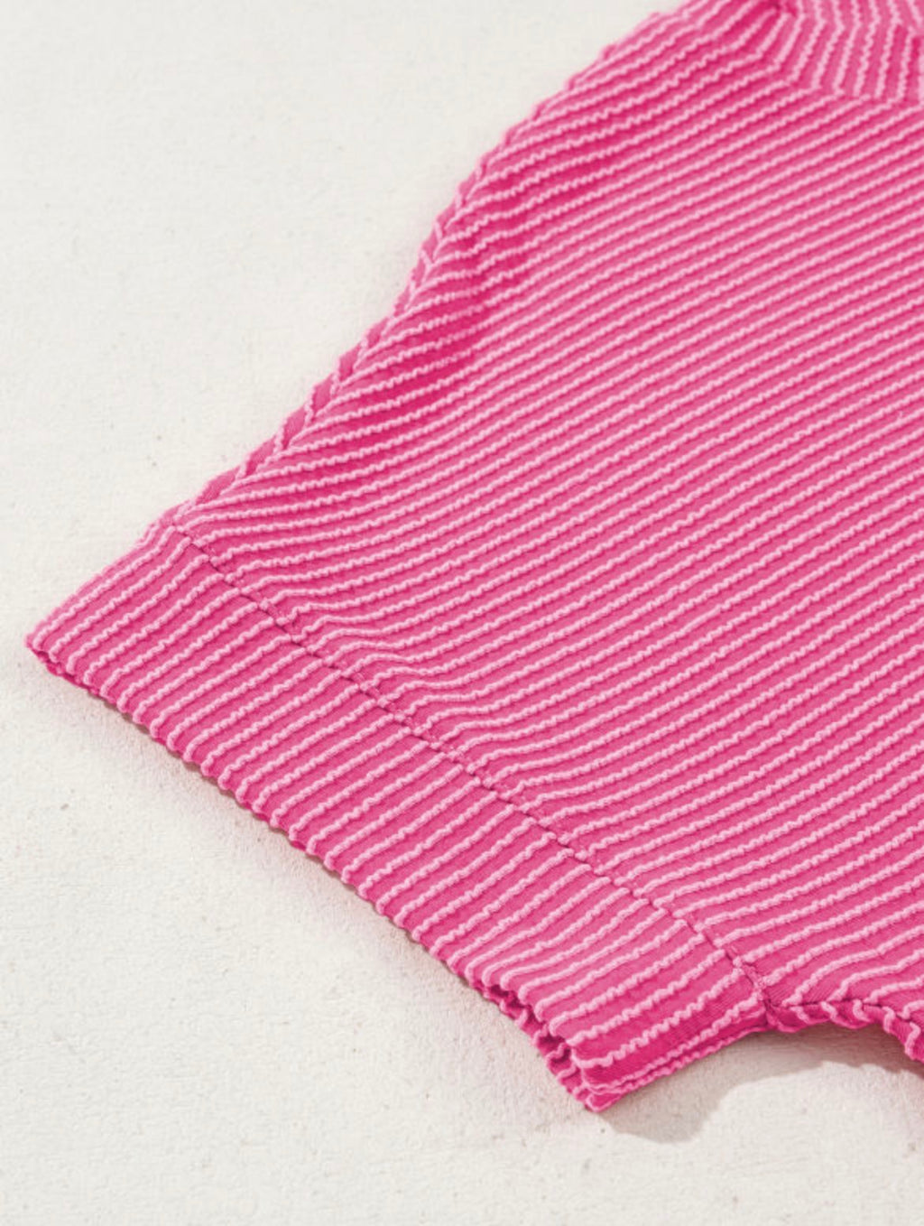 Pink Perfection Rib Tee by Dear-Lover, close-up of fitted pink ribbed cotton t-shirt with crew neckline.