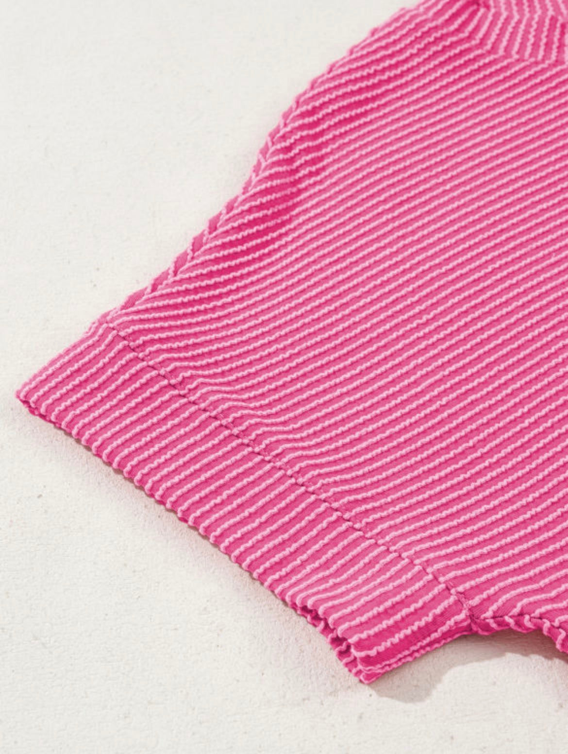 Pink Perfection Rib Tee by Dear-Lover, close-up of fitted pink ribbed cotton t-shirt with crew neckline.