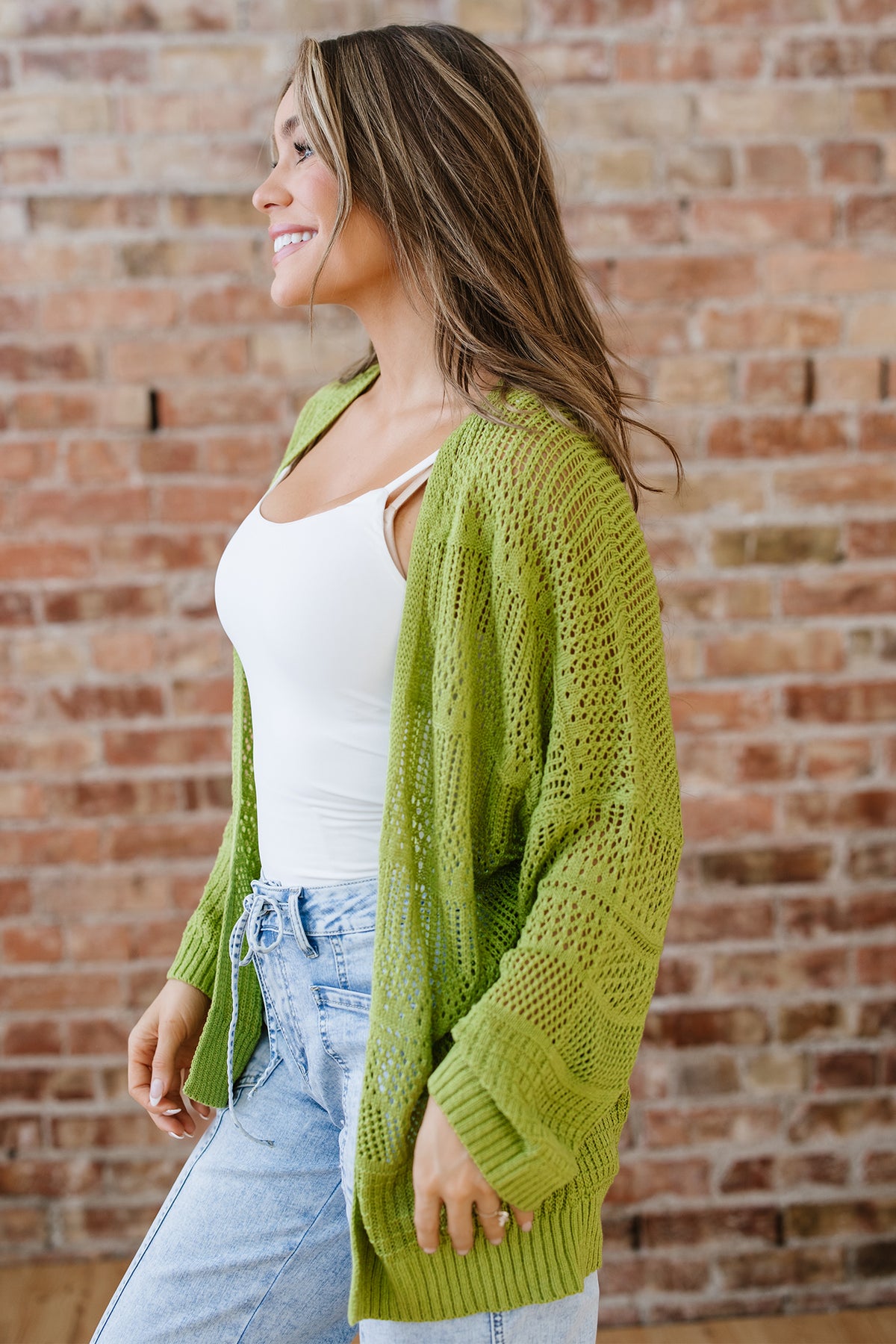 Spinach green oversized crochet knit open cardigan from Dear-Lover, soft acrylic sweater with a relaxed fit and open front design.