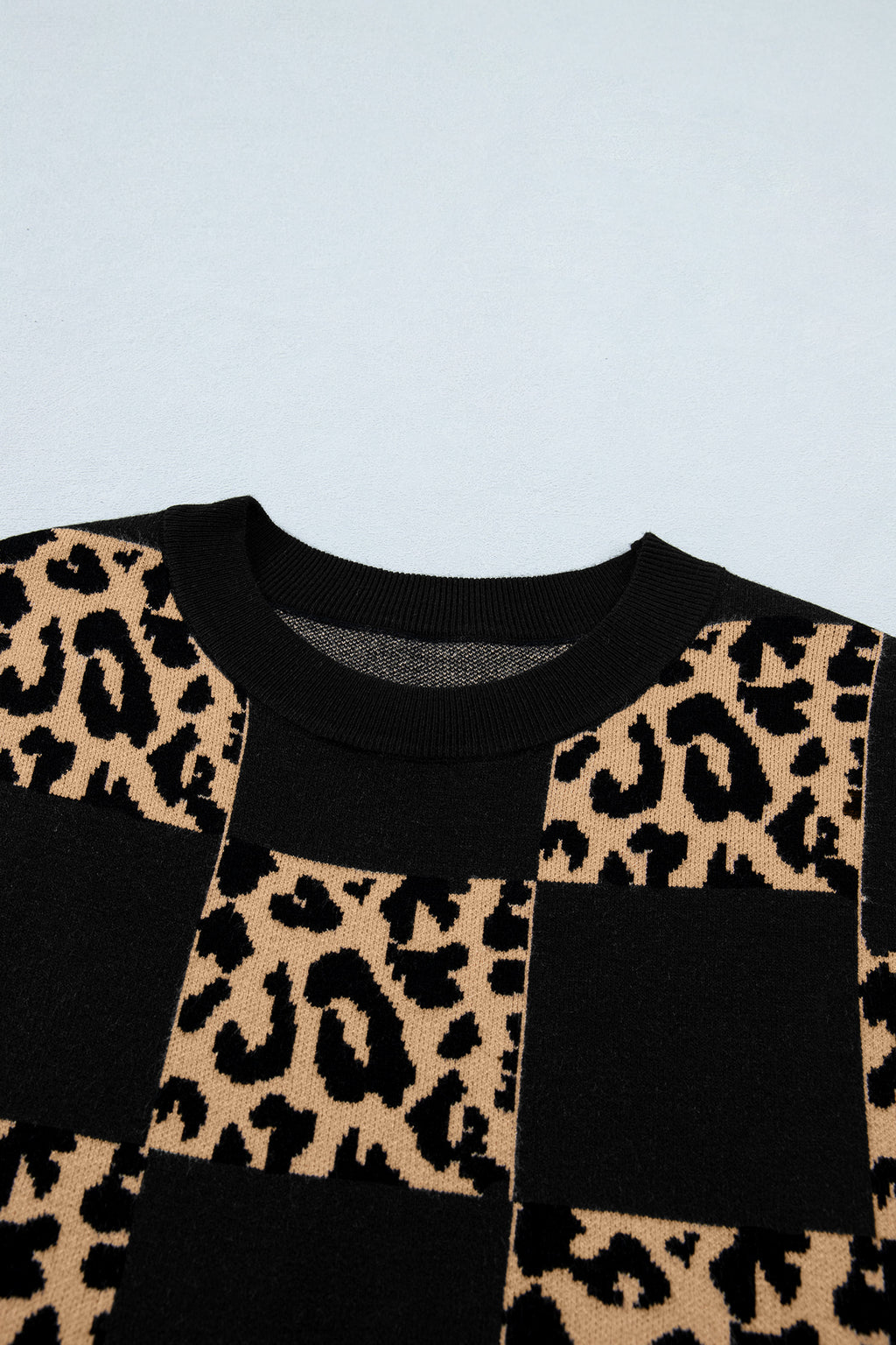 Black leopard checkerboard short sleeve knit sweater by Dear-Lover Dropshipping, featuring a stylish pattern and comfortable fabric blend.