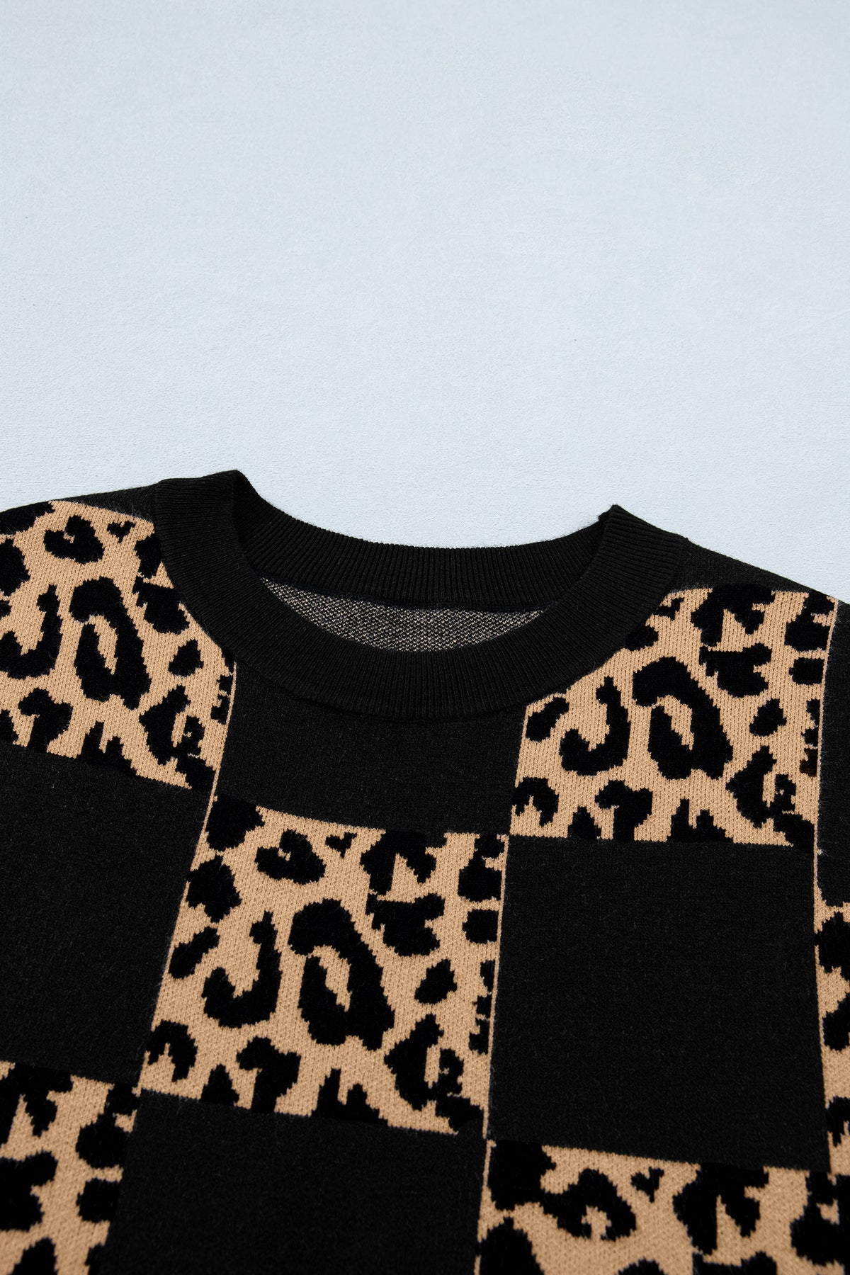 Black leopard checkerboard short sleeve knit sweater by Dear-Lover Dropshipping, featuring a stylish pattern and comfortable fabric blend.