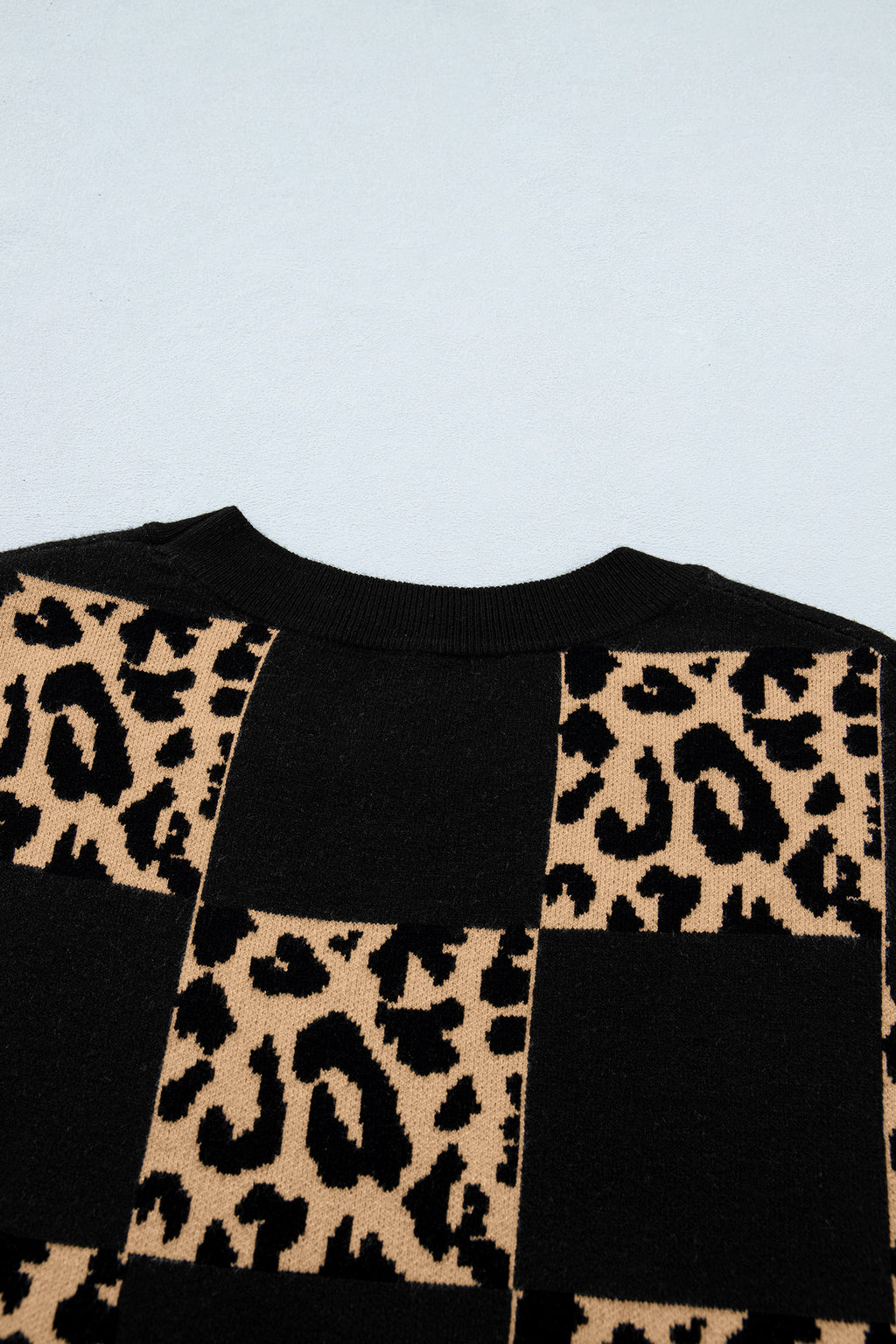 Black leopard checkerboard short sleeve knit sweater by Dear-Lover, featuring a stylish pattern and comfortable viscose blend fabric.