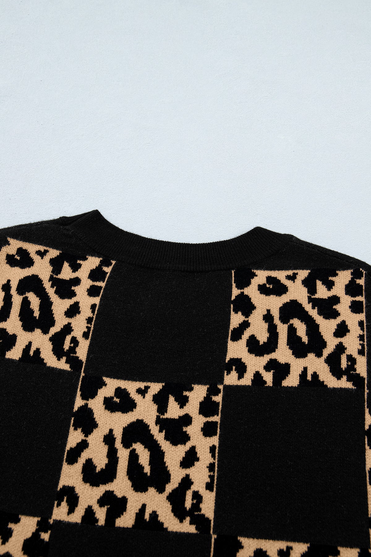 Black leopard checkerboard short sleeve knit sweater by Dear-Lover, featuring a stylish pattern and comfortable viscose blend fabric.