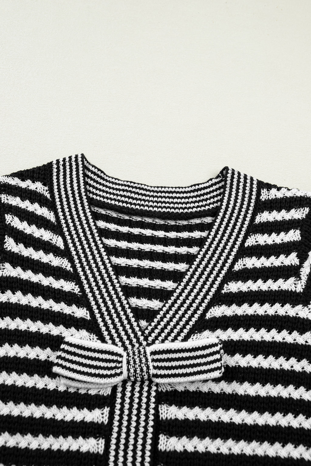 Black stripe short sleeve knit sweater with V-neck and bow knot detail from Dear-Lover, made of cotton and acrylic.