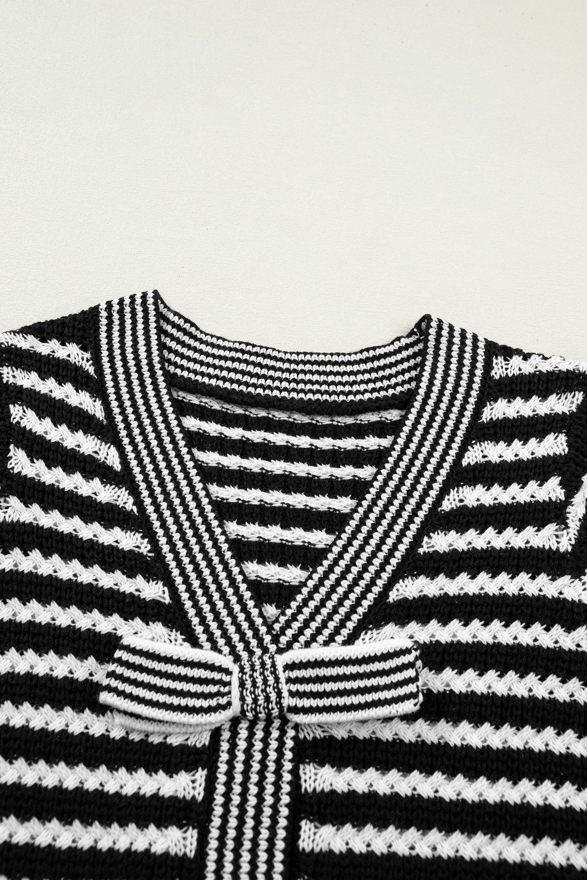 Black stripe short sleeve knit sweater with V-neck and bow knot detail from Dear-Lover, made of cotton and acrylic.