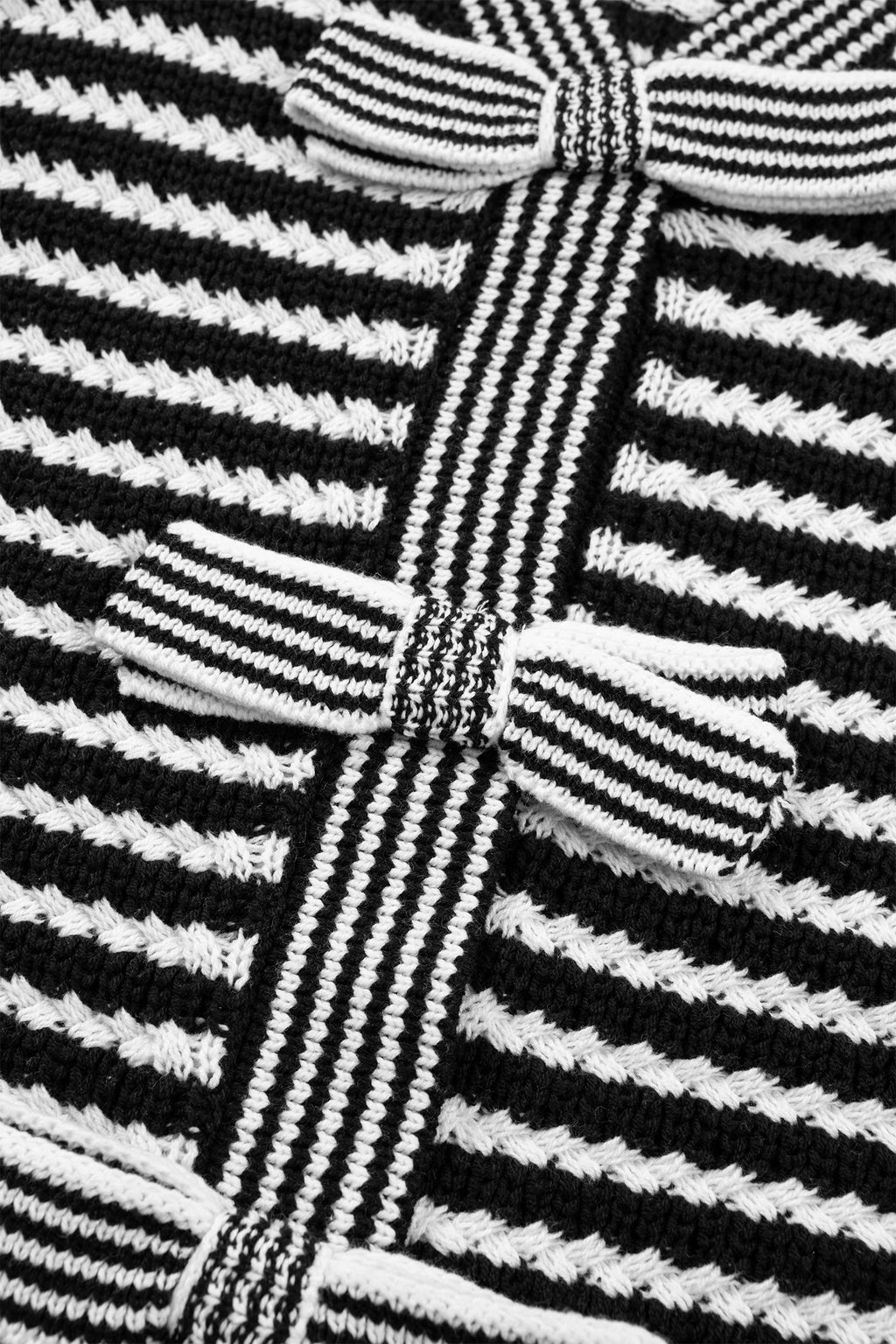 Black stripe short sleeve knit sweater with V-neck and bow knot detail, by Dear-Lover, made from cotton and acrylic blend.