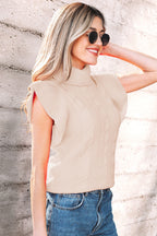 Dear-Lover Jet Stream cable knit turtleneck short sleeve sweater with ruffled details, made from viscose, polyester, and polyamide.