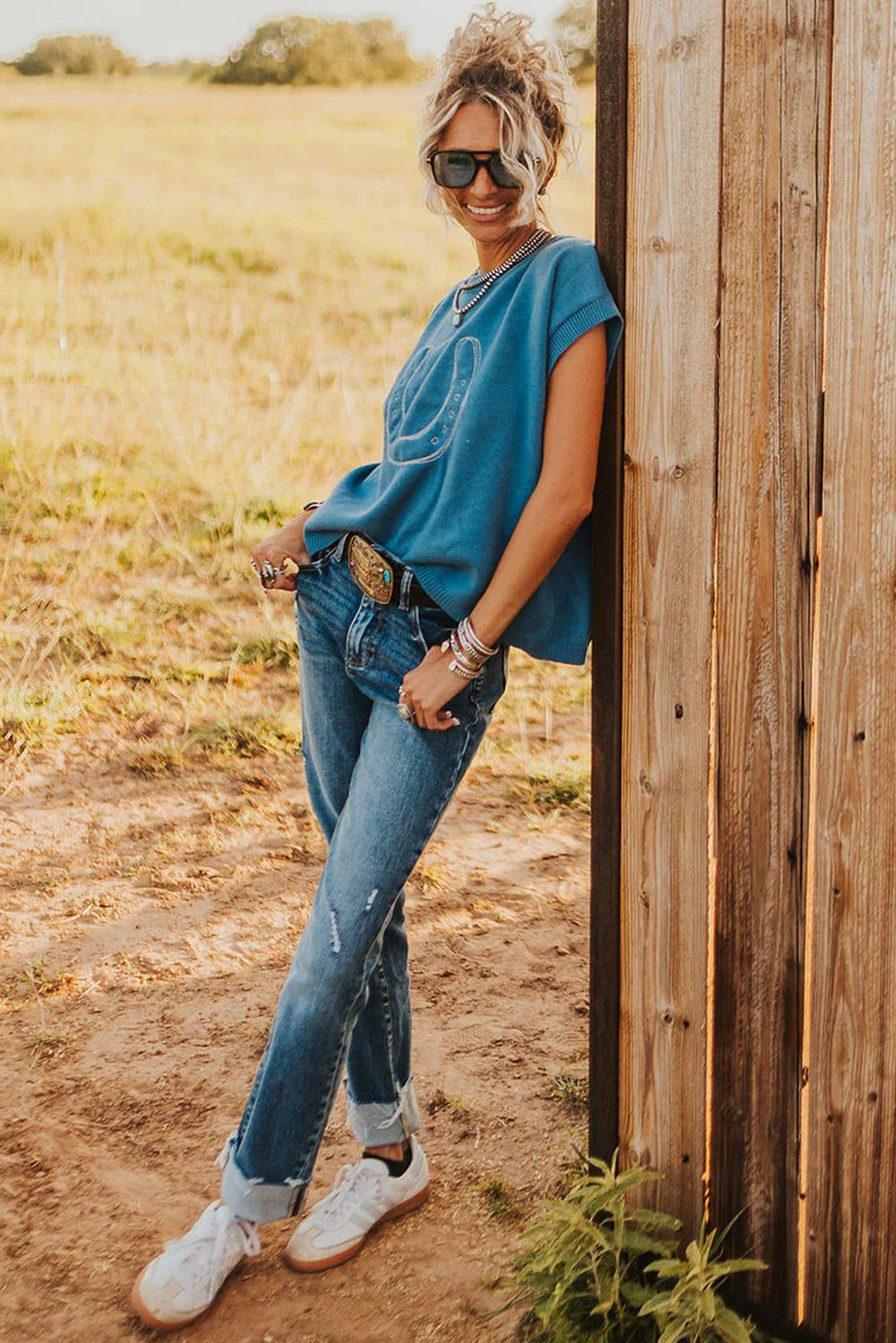 Light blue Dear-Lover short sleeve sweater with horse shoe embroidery, loose fit, made of viscose, polyester, and polyamide.
