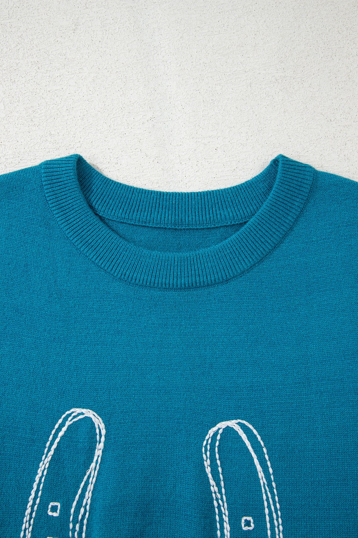 Light blue horse shoe embroidered loose short sleeve sweater from Dear-Lover, made of viscose, polyester, and polyamide.