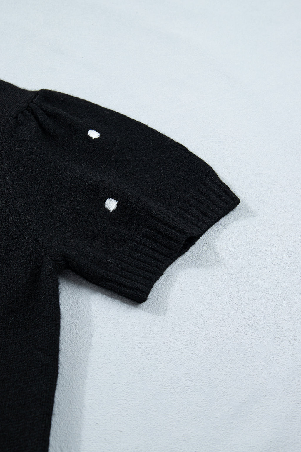 Black polka dot bubble short sleeve sweater by Dear-Lover, elegant design with a loose fit, made of viscose, polyester, and polyamide.