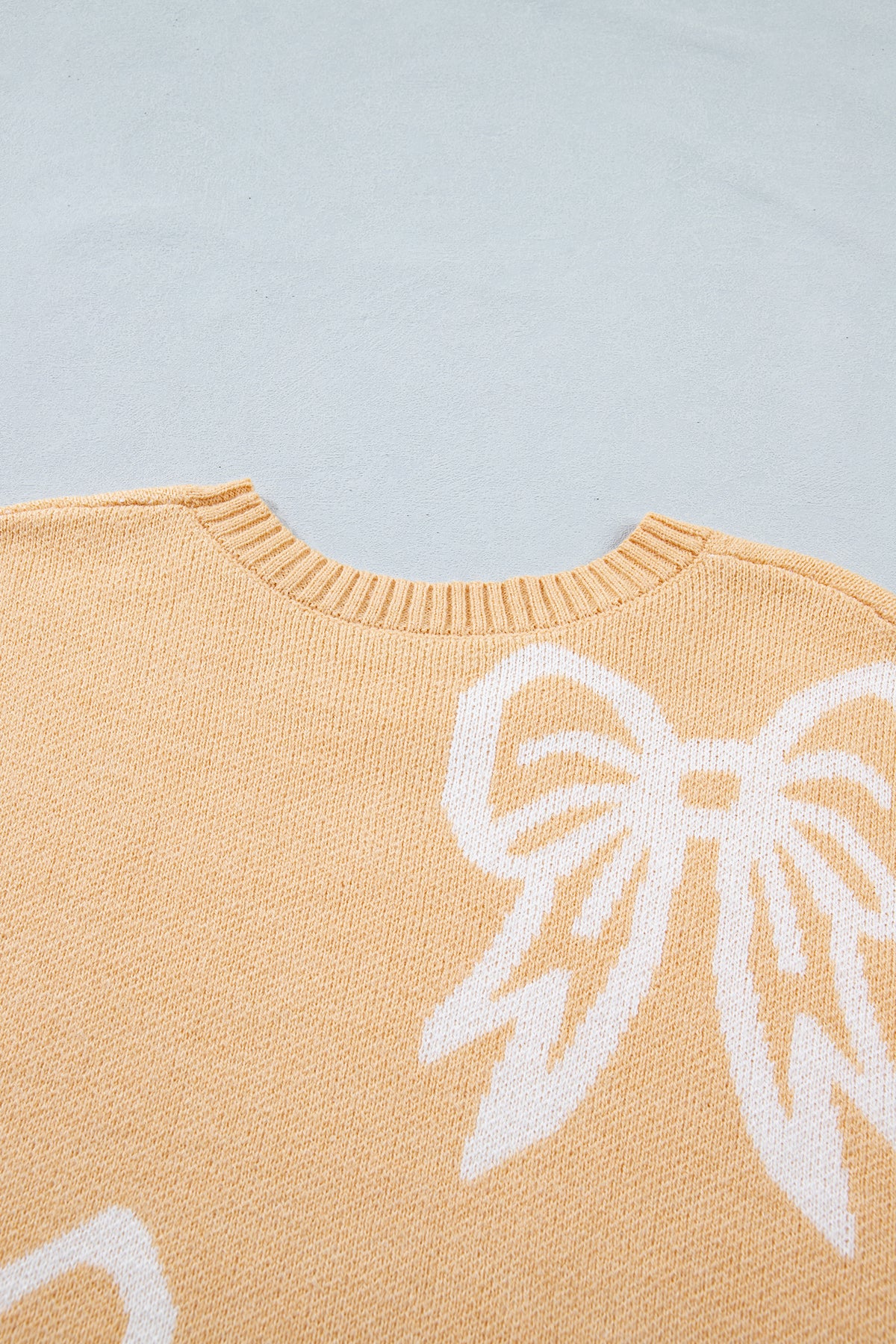 Golden fleece bow pattern drop shoulder loose sweater by Dear-Lover, with a cozy, relaxed fit and stylish design.