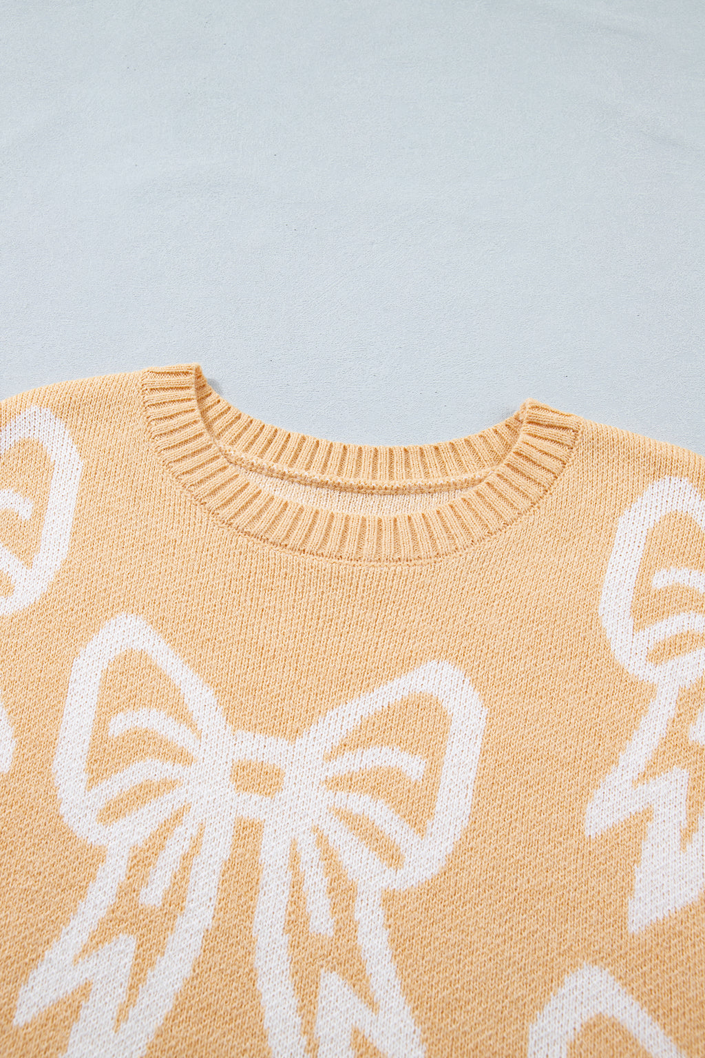 Golden fleece bow pattern drop shoulder sweater by Dear-Lover, loose fit, cozy knit, stylish casual sweater with bow accents.