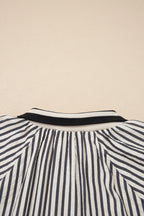 Black stripe polo collar blouse with half-zip, short puff sleeves, made of polyester and viscose, by Dear-Lover for stylish tops.