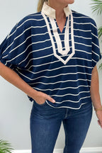 Black stripe Dear-Lover dolman top with stand collar, V-neck, elastic cuffs, and half sleeves made of cotton and elastane fabric.