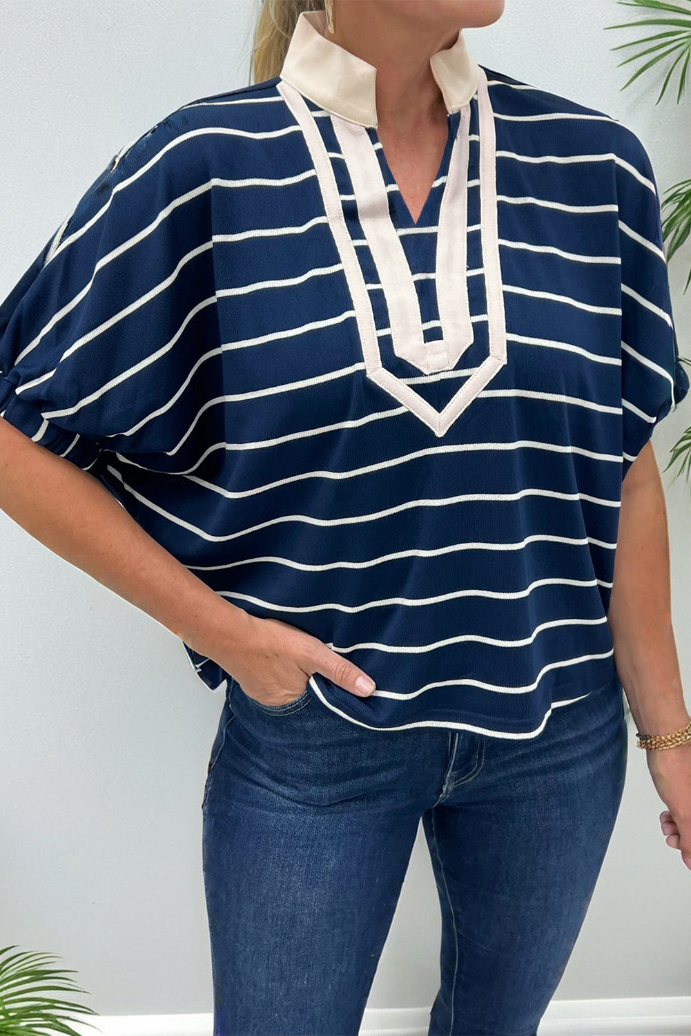 Black stripe Dear-Lover dolman top with stand collar, V-neck, elastic cuffs, and half sleeves made of cotton and elastane fabric.