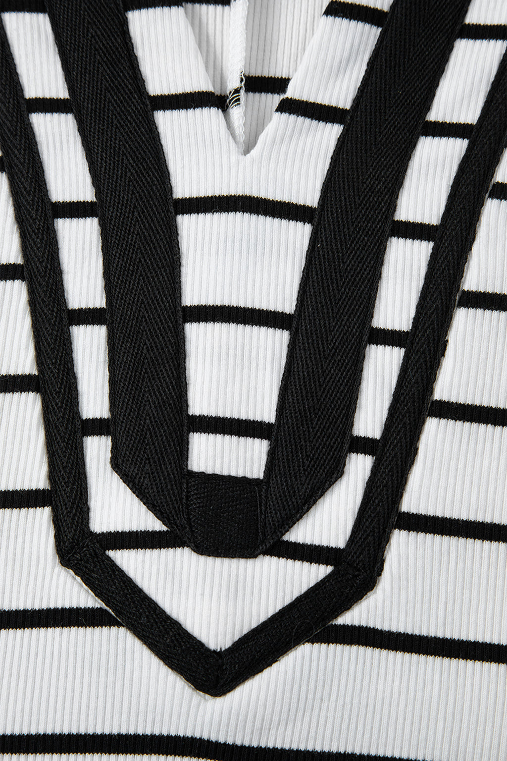 Black stripe Dolman top with stand collar, V-neck, elastic cuffs, and half sleeves, made of cotton and elastane.