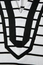 Black stripe Dolman top with stand collar, V-neck, elastic cuffs, and half sleeves, made of cotton and elastane.