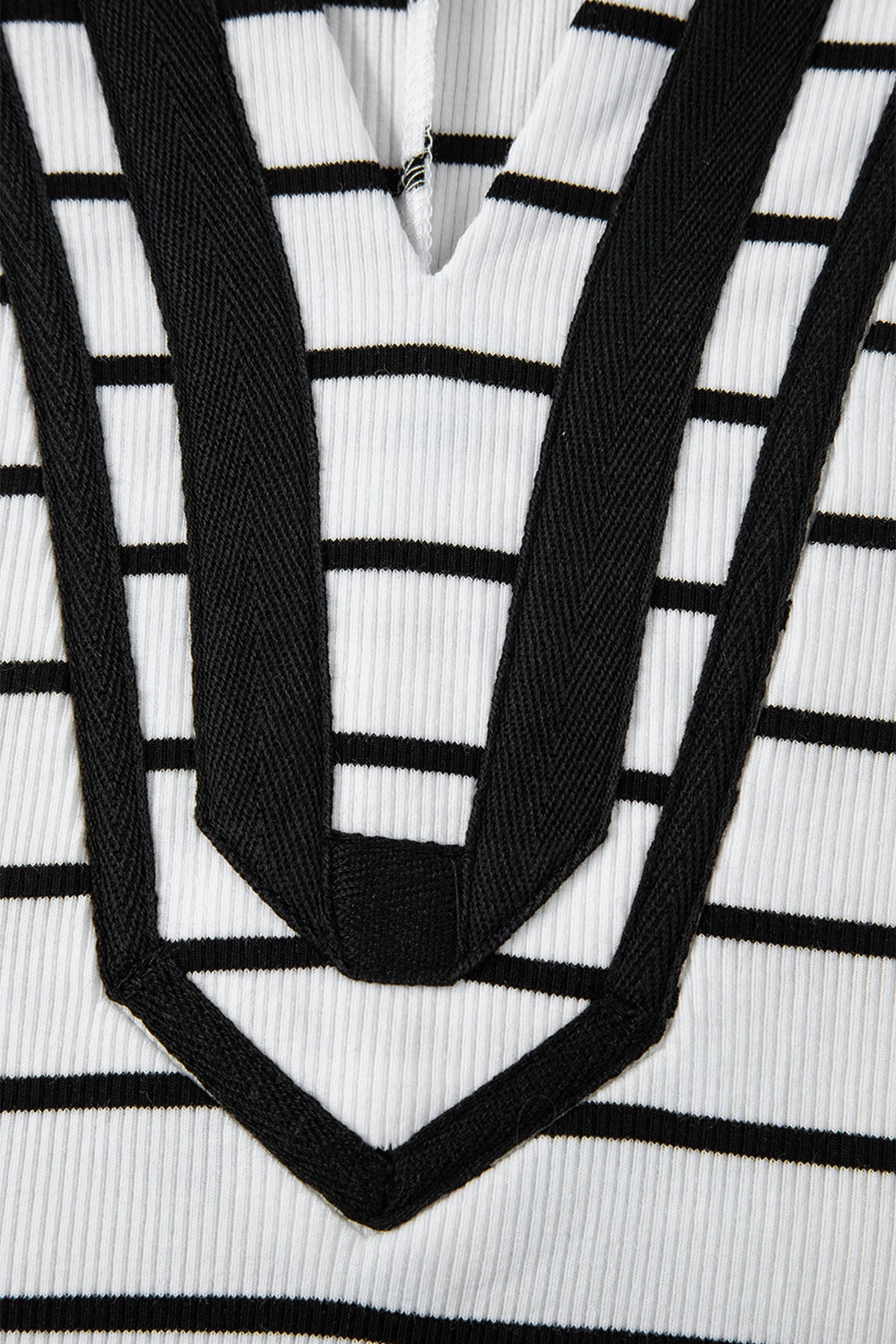 Black stripe Dolman top with stand collar, V-neck, elastic cuffs, and half sleeves, made of cotton and elastane.