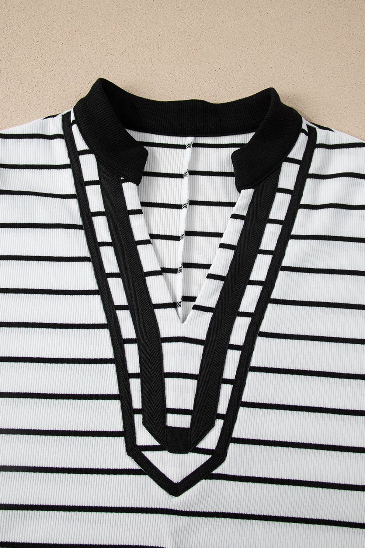 Black stripe Dear-Lover dolman top with stand collar, V-neck, elastic cuffs, half sleeves, made of cotton and elastane.