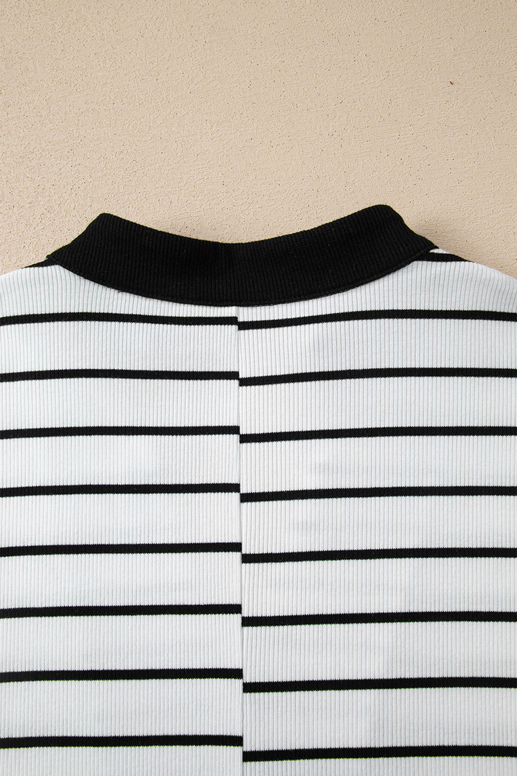 Black stripe Dear-Lover blouse with stand collar, V-neck, elastic cuffs, half sleeves, and dolman style made of cotton and elastane.
