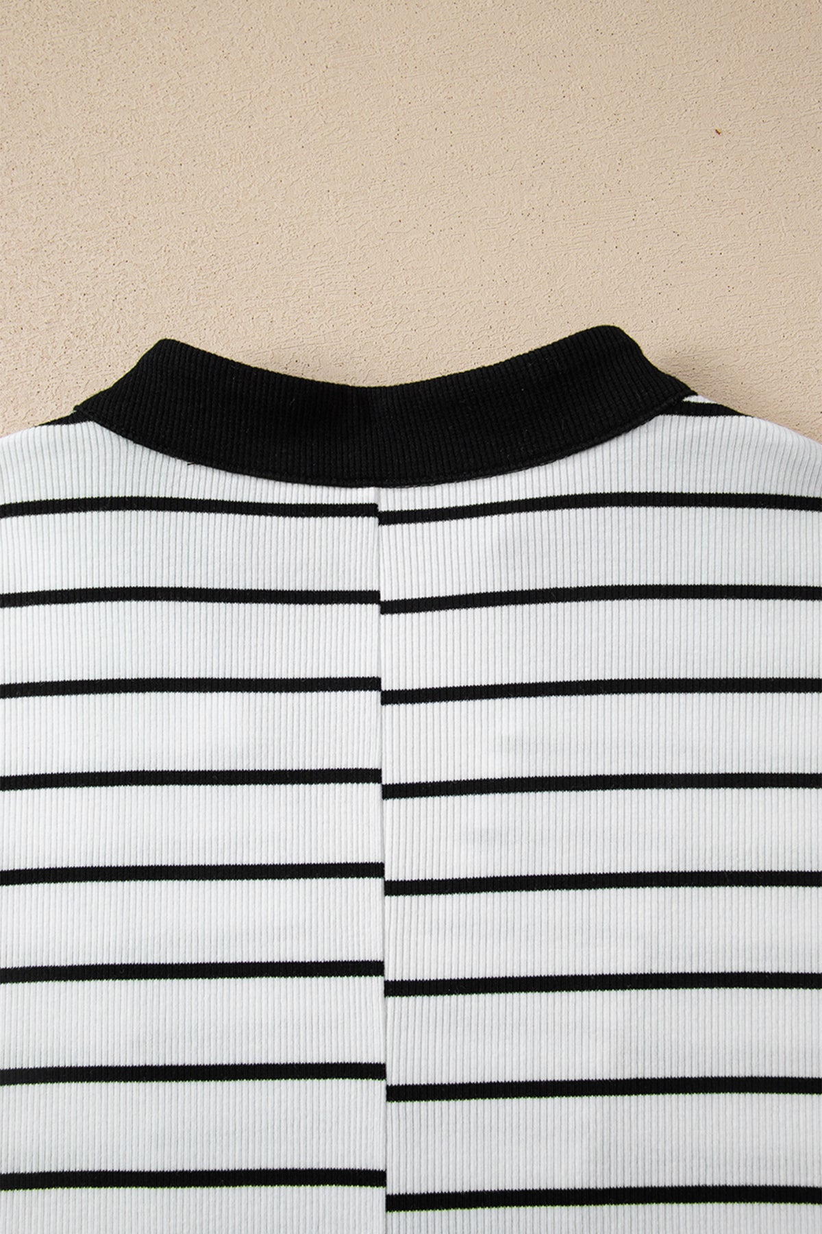 Black stripe Dear-Lover blouse with stand collar, V-neck, elastic cuffs, half sleeves, and dolman style made of cotton and elastane.