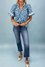 Blue floral print blouse by Dear-Lover with button tie neck, striped detail, short sleeves, made from 100% cotton.