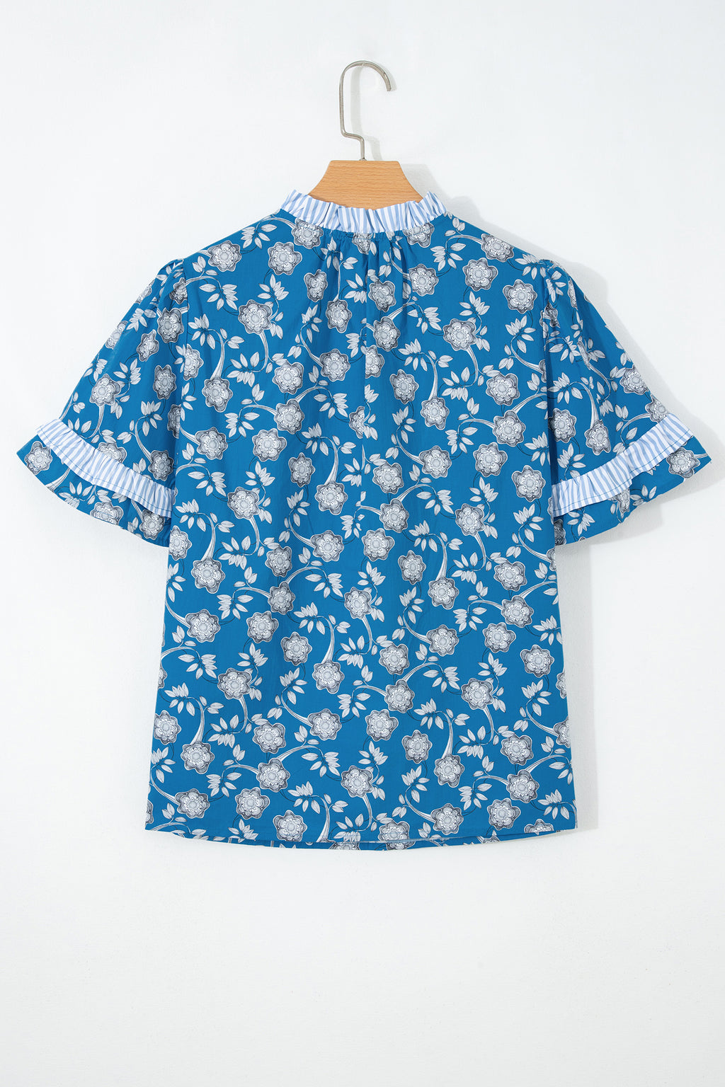 Blue floral print blouse by Dear-Lover with striped detail, short sleeves, button tie neckline, made from 100% cotton.