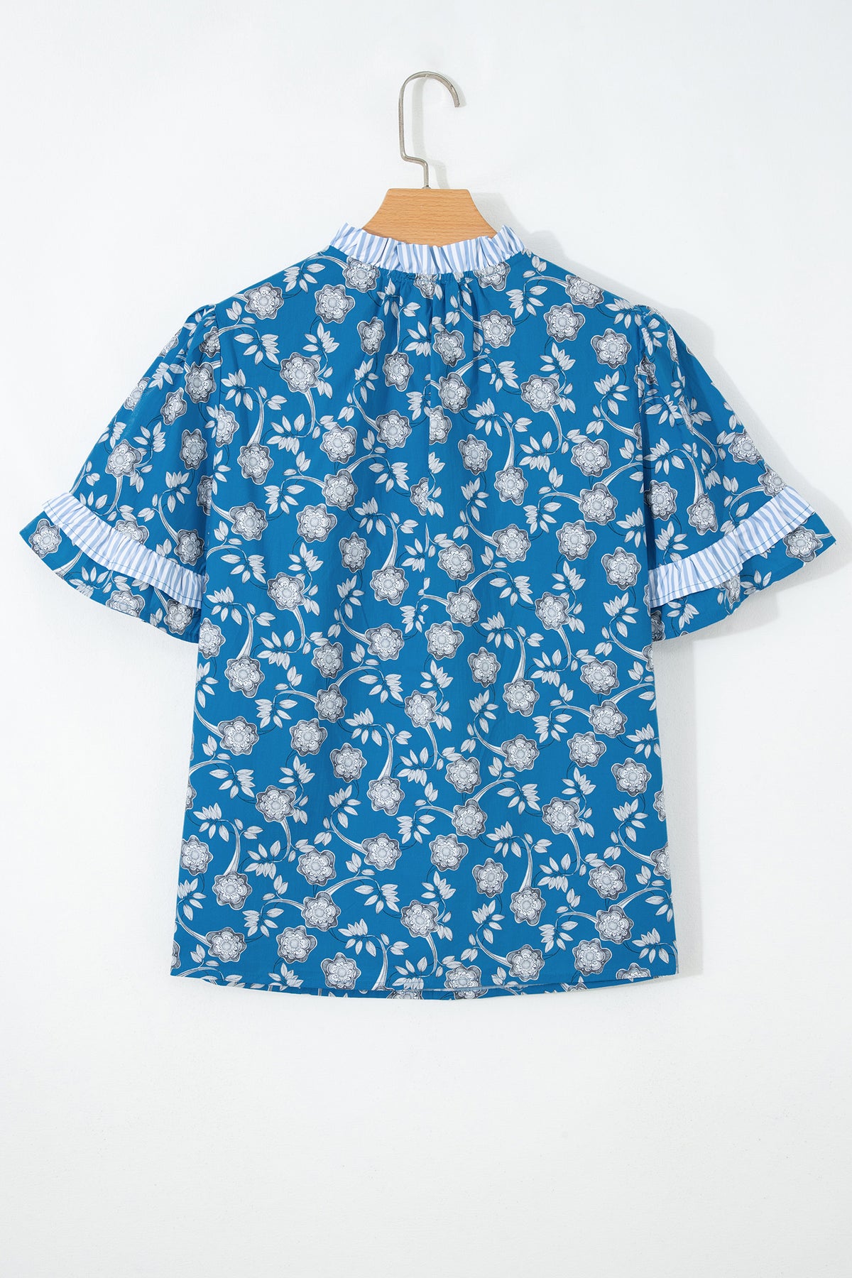 Blue floral print blouse by Dear-Lover with striped detail, short sleeves, button tie neckline, made from 100% cotton.