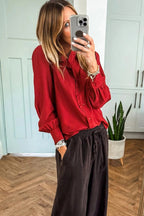 Fiery red pleated long sleeve blouse with frilled trim and button-up front, made of polyester, from Dear-Lover.