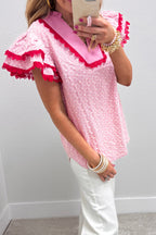 Pink eyelet embroidered flower texture blouse with contrast lace trim and flutter sleeves, perfect for stylish casual wear.