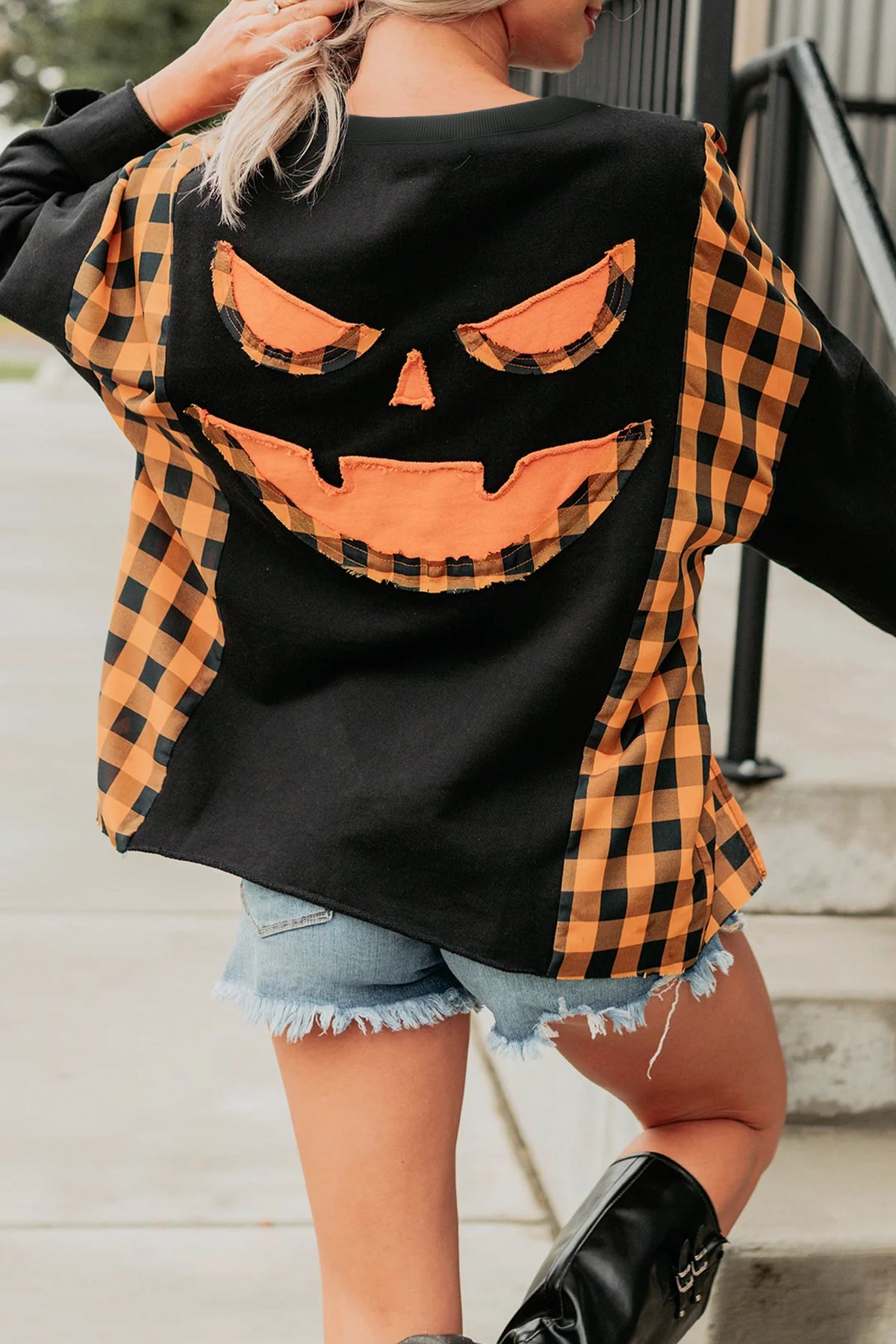 Black patchwork plaid long sleeve top with pumpkin face design by Dear-Lover Dropshipping, featuring a casual, cozy style.