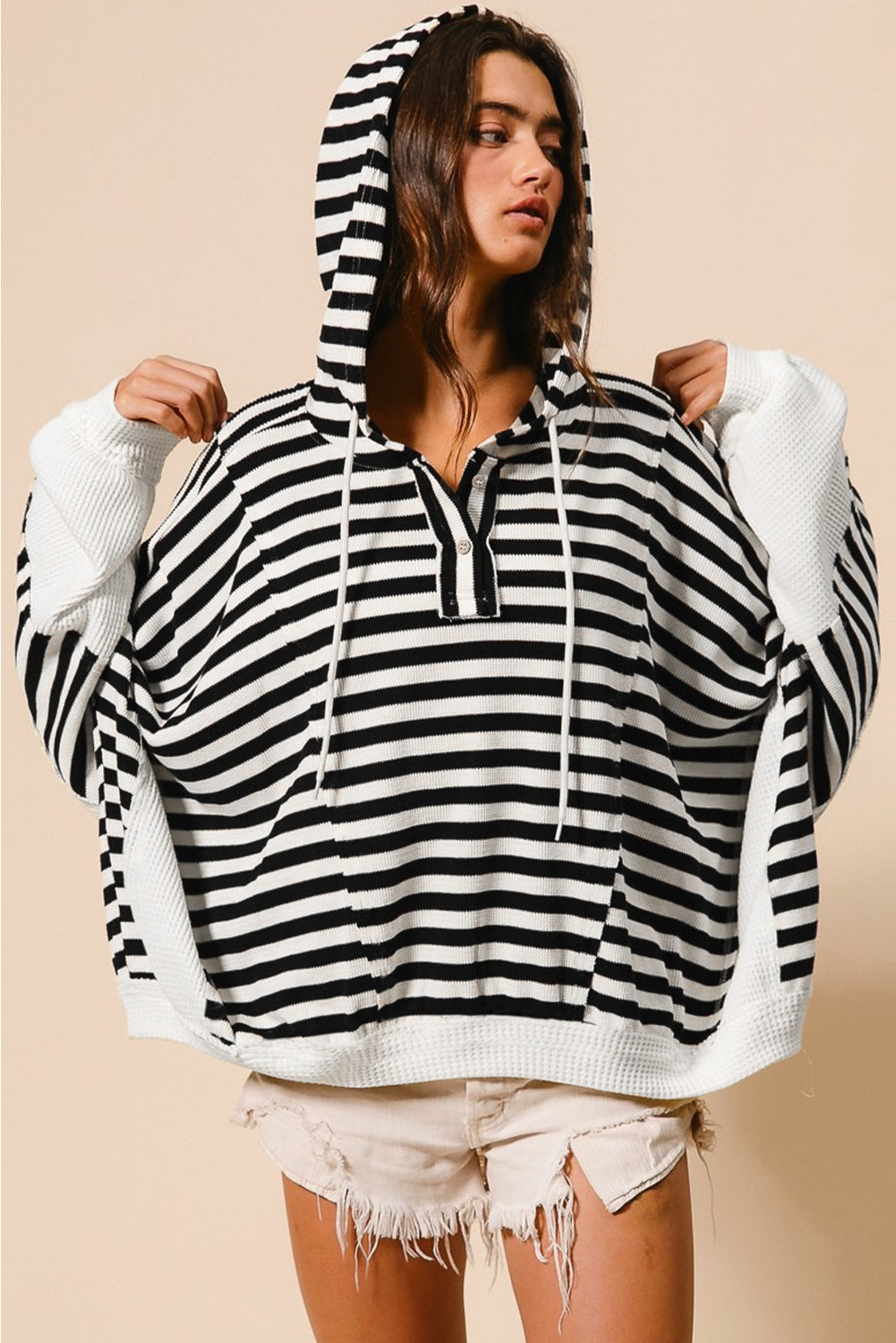 Black and white oversized striped Henley hooded top with dolman sleeves, made by Dear-Lover, featuring buttons and long sleeve design.