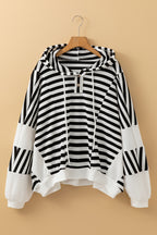 Black and white oversized striped Henley hooded top with dolman sleeves, made of polyester and elastane, by Dear-Lover.