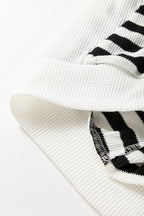 Black and white oversized striped Henley hooded top with dolman sleeves, made of polyester and elastane, from Dear-Lover.