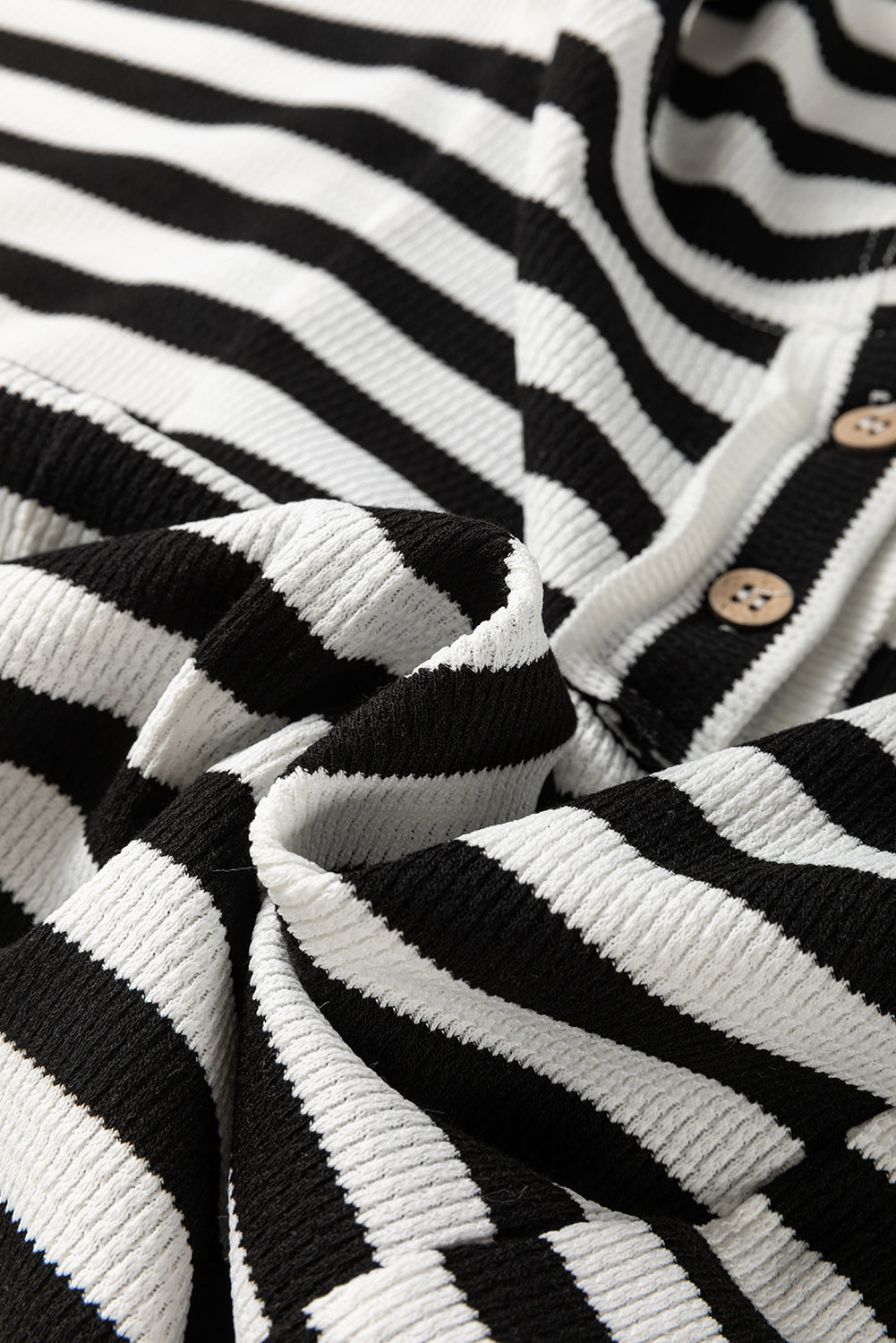 Black and white oversized striped Henley hooded top by Dear-Lover with dolman sleeves, buttons, and long sleeve design.