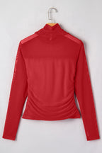 Dear-Lover sheer mesh patchwork coffee-colored long sleeve top with high neck, made of polyester and elastane.