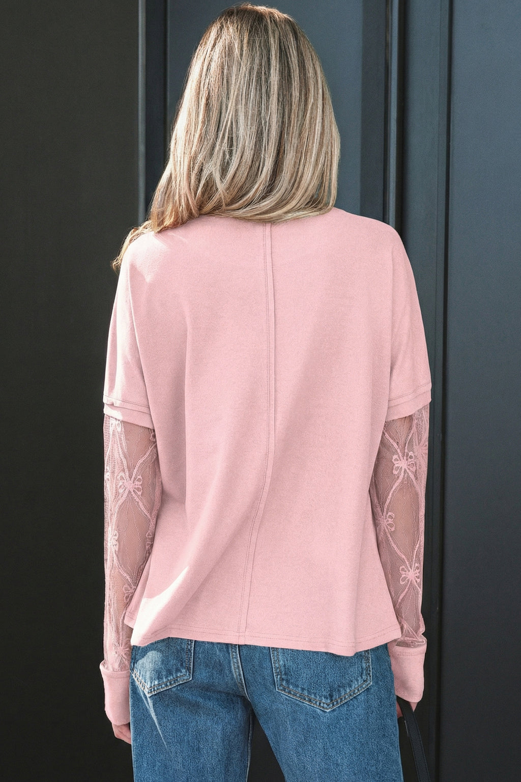 Light pink long sleeve tee by Dear-Lover with textured patchwork and bow details, made of polyester and elastane fabric.
