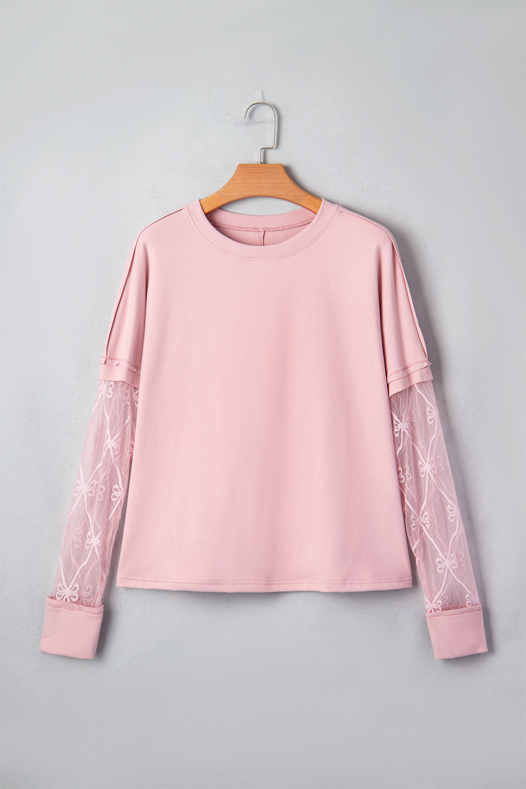 Light pink solid color long sleeve tee with bow textured patchwork details, made by Dear-Lover, stylish and comfortable for casual wear.
