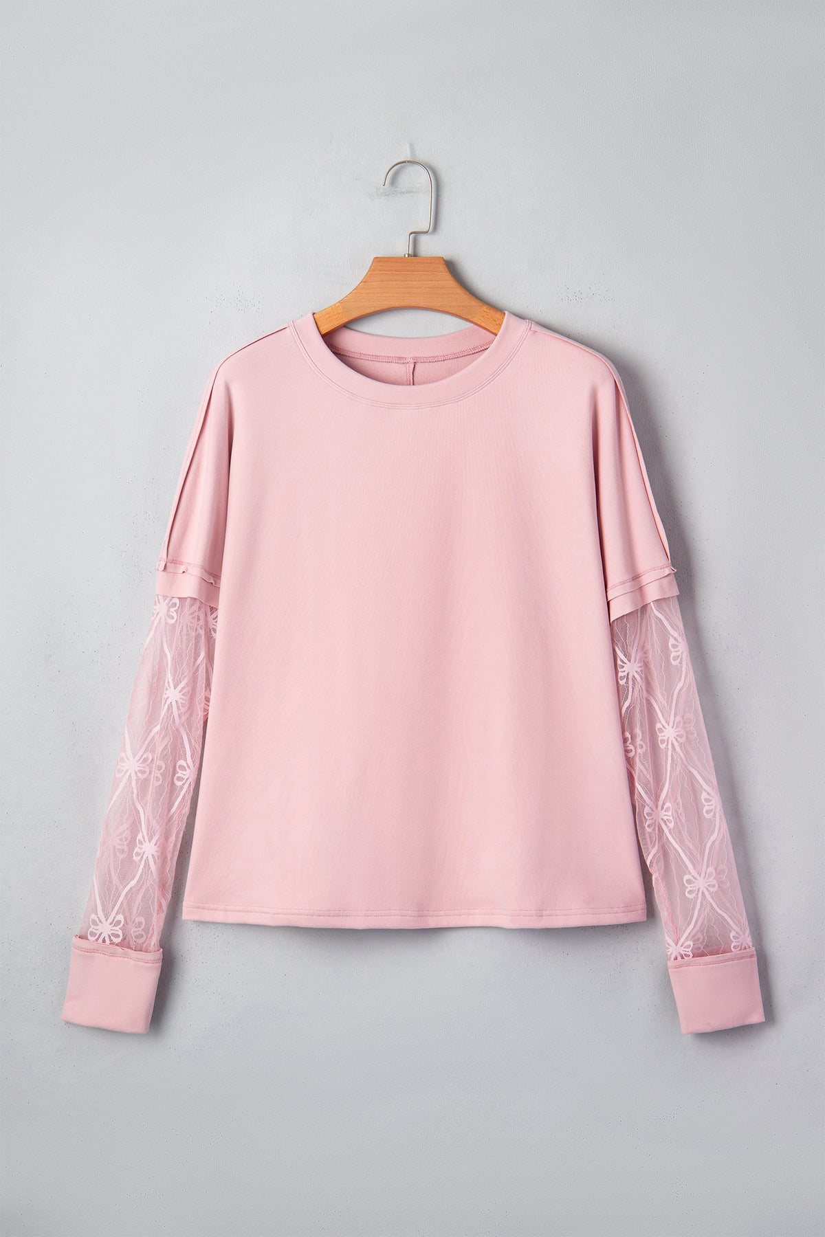 Light pink solid color long sleeve tee with bow textured patchwork details, made by Dear-Lover, stylish and comfortable for casual wear.